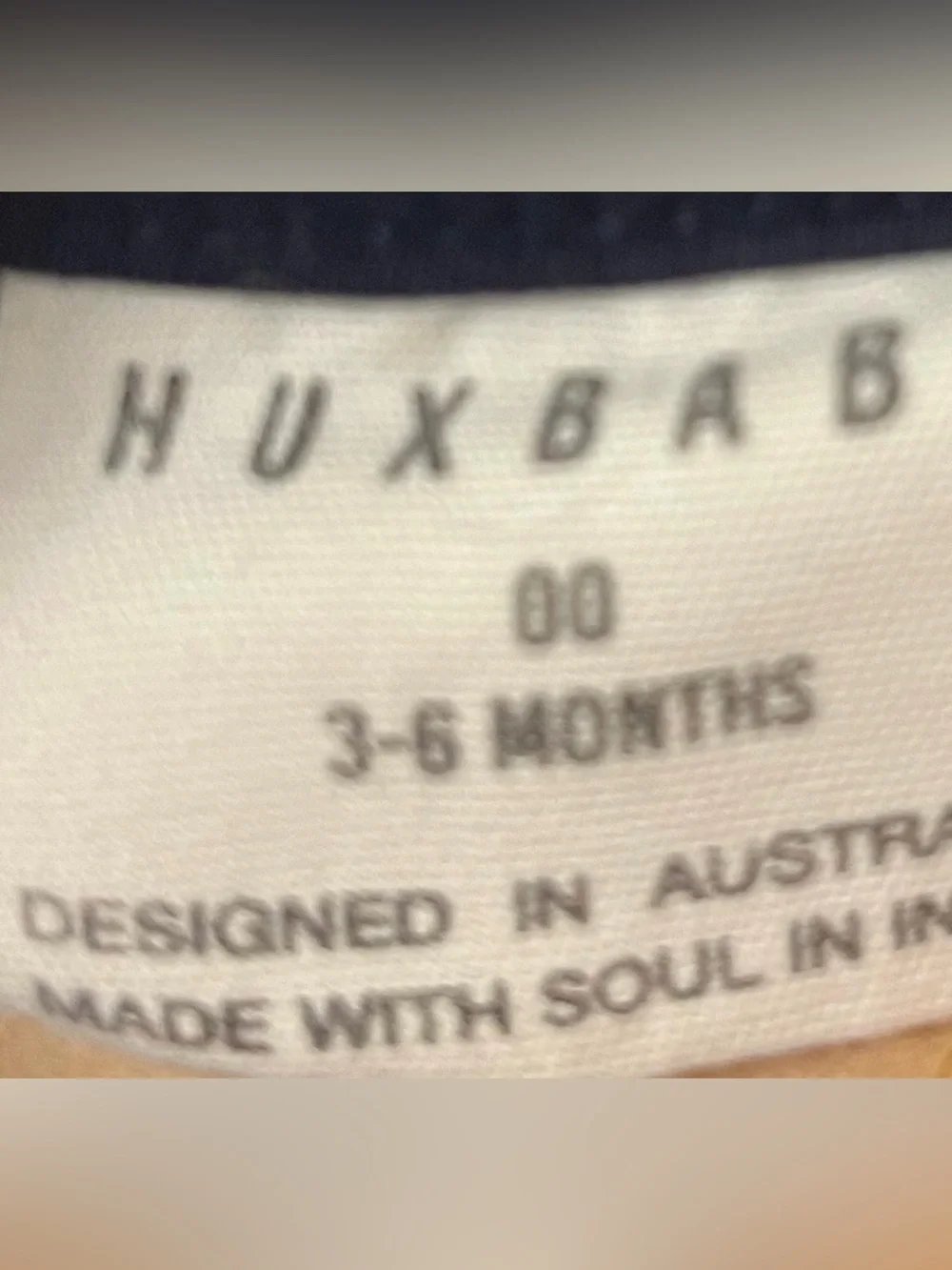 Huxbaby Unisex Seal Embroidery Short Sleeve Onesie in navy